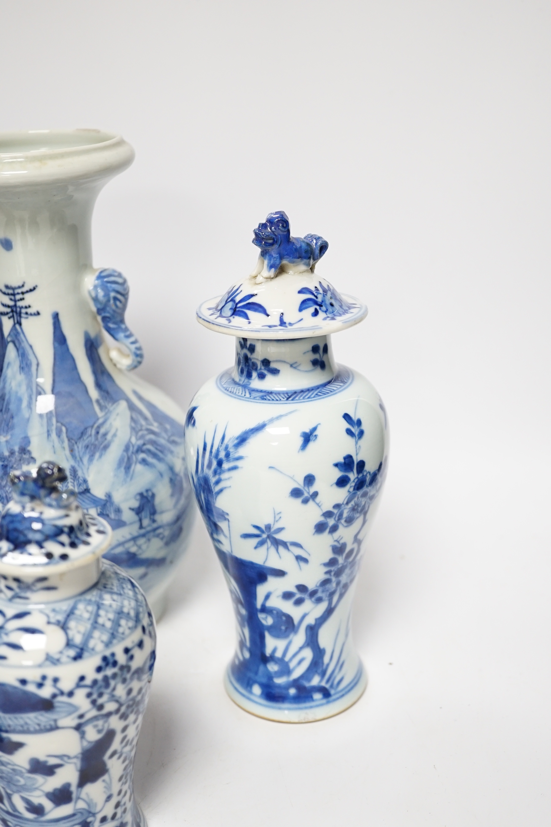 A late 19th century Chinese blue and white twin elephant head handle vase and five other 19th century Chinese blue and white vases, tallest 26cm
